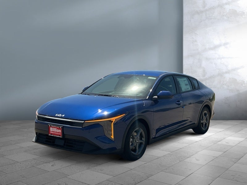 2026 Kia K4 LXS in Blue — front three-quarter view