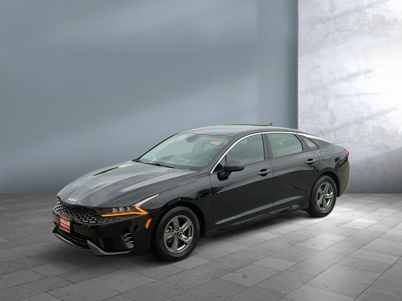 2023 Kia K5 LXS in Ebony Black — front three-quarter view