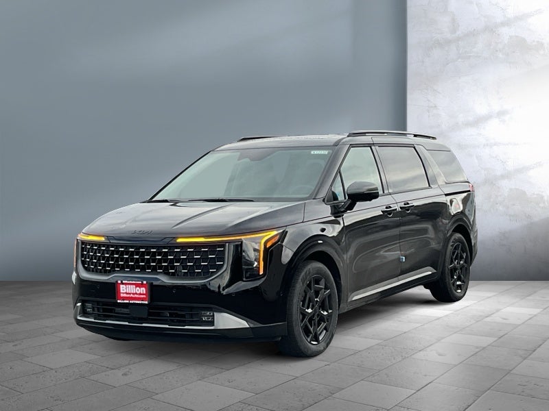 2026 Kia Carnival Hybrid SX in Aurora Black Pearl — front three-quarter view